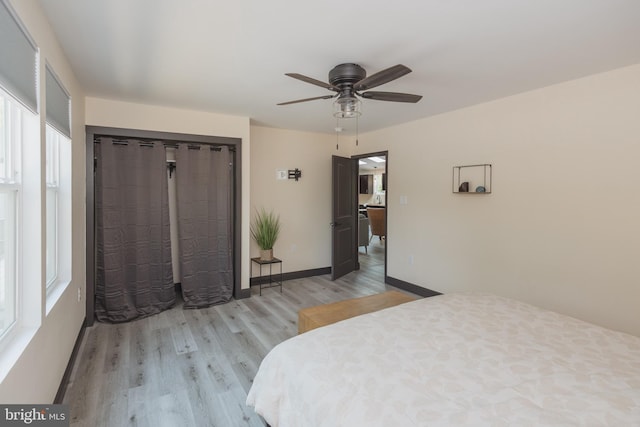 bedroom featuring light wood-type flooring and ceiling fan