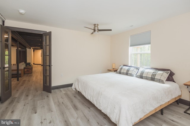 bedroom featuring ceiling fan and light hardwood / wood-style flooring