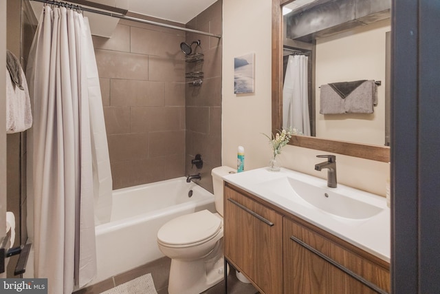 full bathroom with vanity, shower / bath combo with shower curtain, toilet, and tile patterned floors