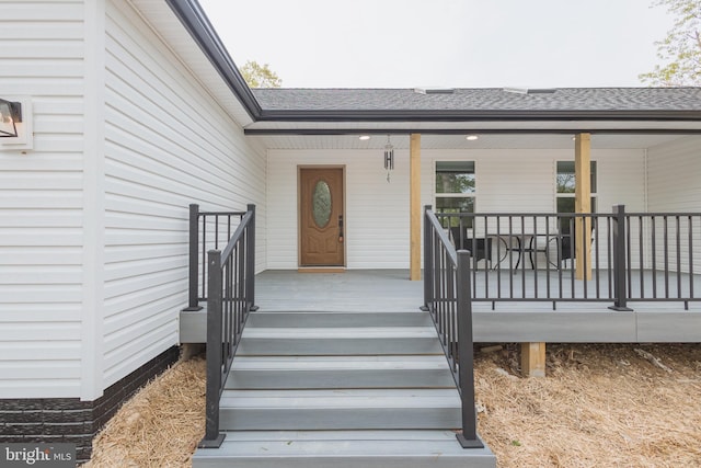 property entrance with covered porch