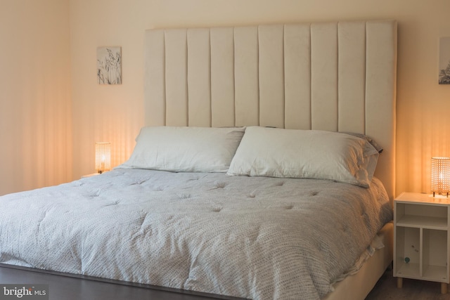 bedroom featuring dark hardwood / wood-style floors