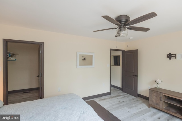 bedroom featuring ceiling fan and light hardwood / wood-style floors