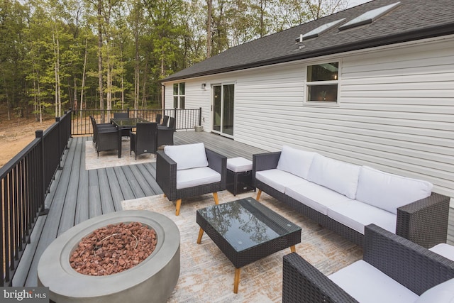 wooden deck featuring an outdoor living space