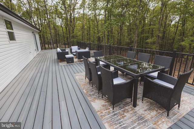 wooden terrace with an outdoor hangout area