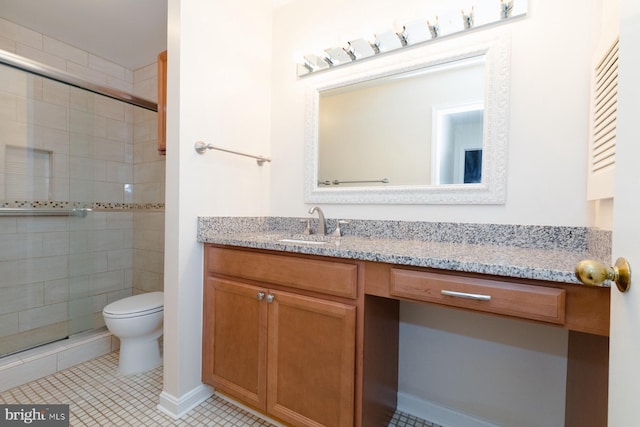 bathroom featuring tile patterned flooring, walk in shower, vanity, and toilet