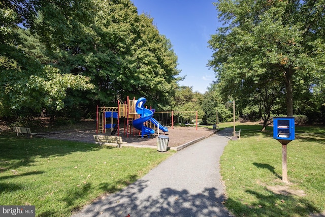 view of play area featuring a lawn