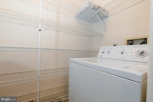 clothes washing area with washer / clothes dryer