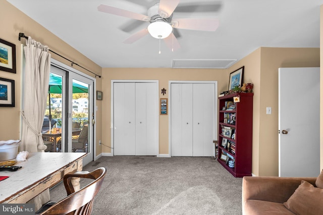 interior space featuring carpet and ceiling fan