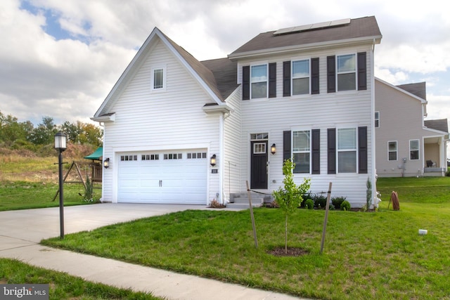 view of front of house featuring a garage, solar panels, and a front lawn