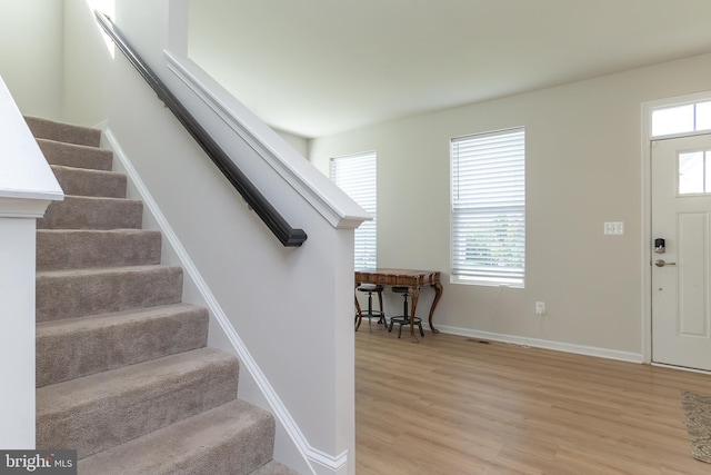 foyer featuring plenty of natural light and light hardwood / wood-style floors