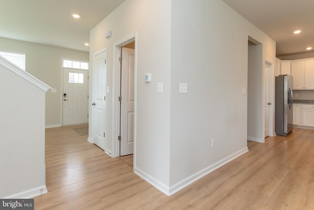 hallway featuring light wood-type flooring