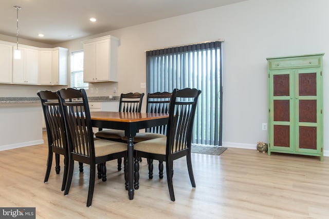 dining area featuring light wood-type flooring