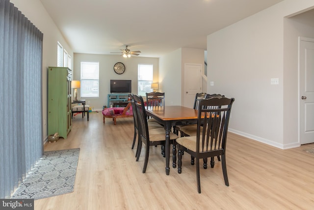 dining room featuring ceiling fan and light hardwood / wood-style floors