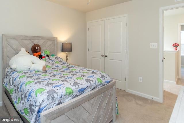 carpeted bedroom featuring a closet