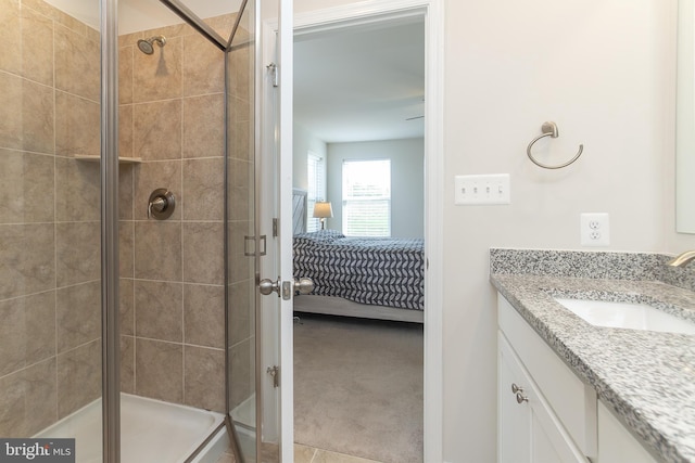 bathroom with vanity and a shower with shower door