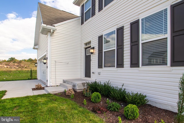 property entrance with a garage