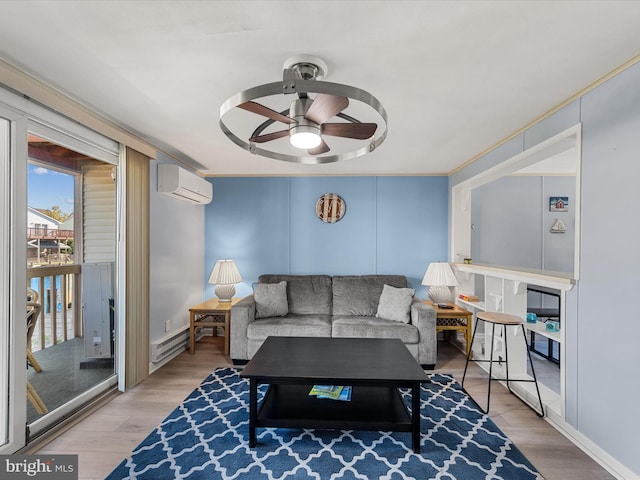 living room with hardwood / wood-style flooring, a baseboard heating unit, a wall mounted air conditioner, ornamental molding, and ceiling fan