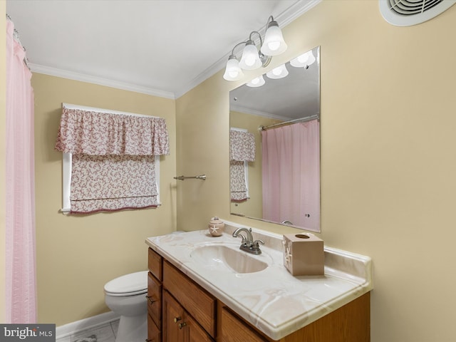 bathroom featuring vanity, ornamental molding, and toilet