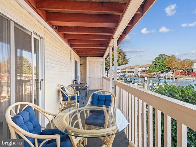 balcony featuring a water view