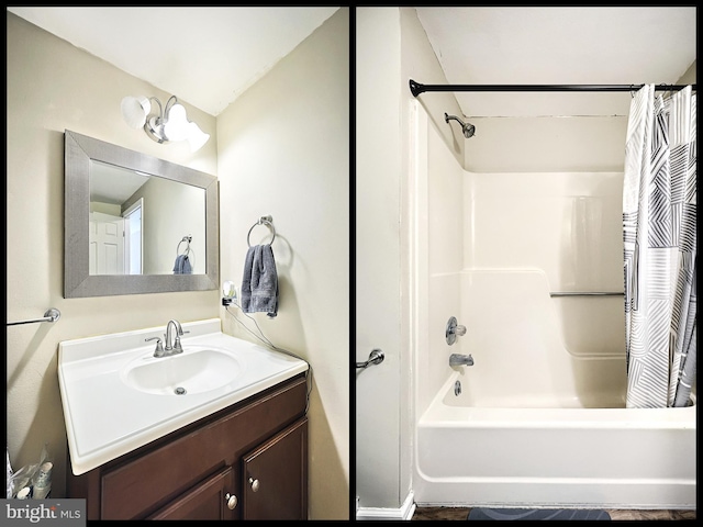 bathroom with shower / tub combo with curtain and vanity