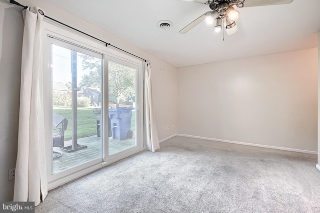 carpeted empty room with ceiling fan