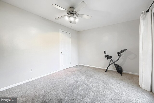 empty room with ceiling fan and carpet floors