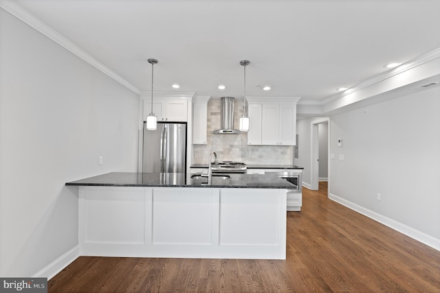 kitchen featuring wall chimney exhaust hood, dark hardwood / wood-style flooring, decorative light fixtures, stainless steel appliances, and white cabinets