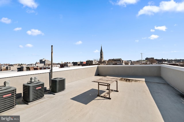 view of patio featuring a balcony and central AC unit