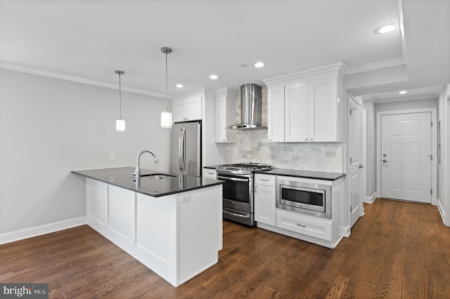 kitchen featuring wall chimney range hood, sink, stainless steel appliances, dark hardwood / wood-style floors, and white cabinets