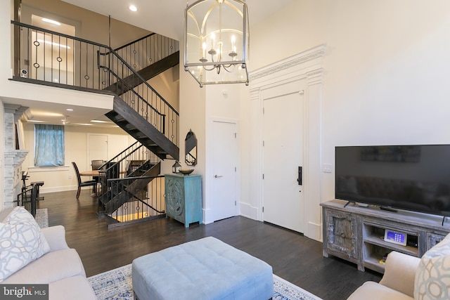 1508 Pine St Unit A, Philadelphia, PA 19102 - living room with a towering ceiling, wood finished floors, baseboards, a notable chandelier, and stairs