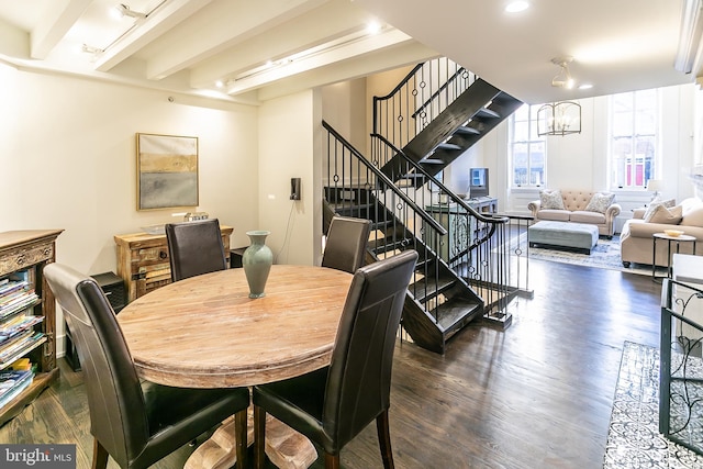 dining room featuring beamed ceiling, a notable chandelier, and dark hardwood / wood-style flooring