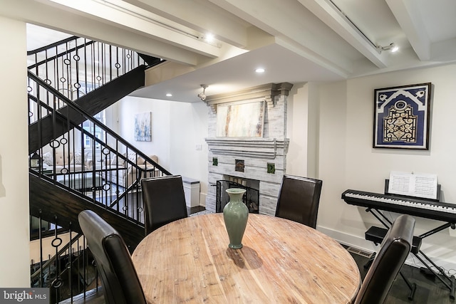 1508 Pine St Unit A, Philadelphia, PA 19102 - dining area with baseboards, stairs, a tiled fireplace, and beamed ceiling