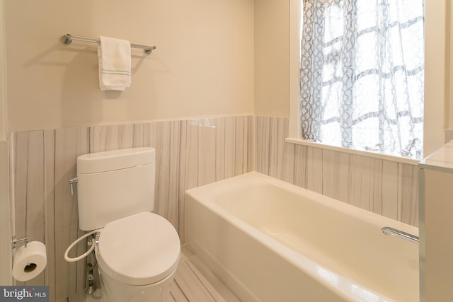 bathroom with a bathtub and toilet