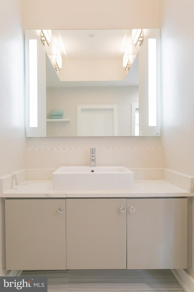 bathroom with vanity and a wealth of natural light