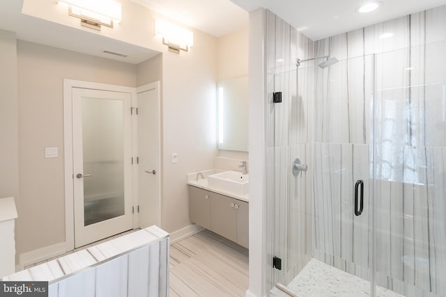 bathroom with vanity and walk in shower