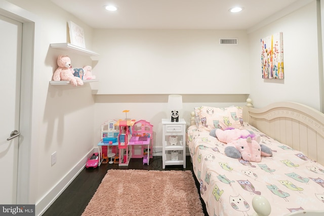 bedroom featuring dark hardwood / wood-style flooring