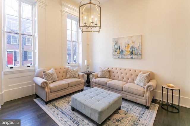 1508 Pine St Unit A, Philadelphia, PA 19102 - living area featuring baseboards, a towering ceiling, a notable chandelier, and dark wood-style floors