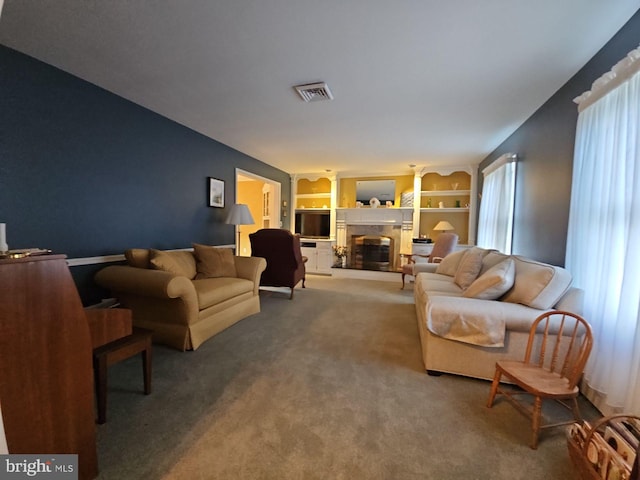 living room featuring carpet floors and plenty of natural light