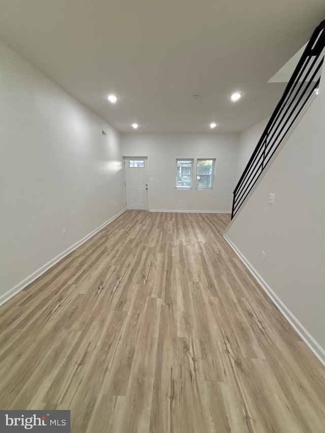 unfurnished living room featuring light hardwood / wood-style floors