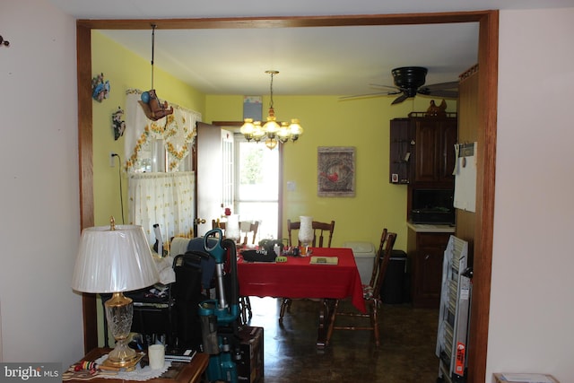 dining space with ceiling fan with notable chandelier