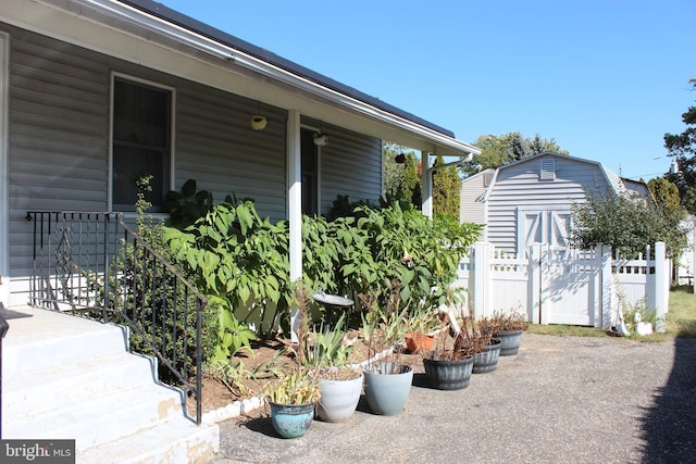 view of property exterior featuring a storage unit