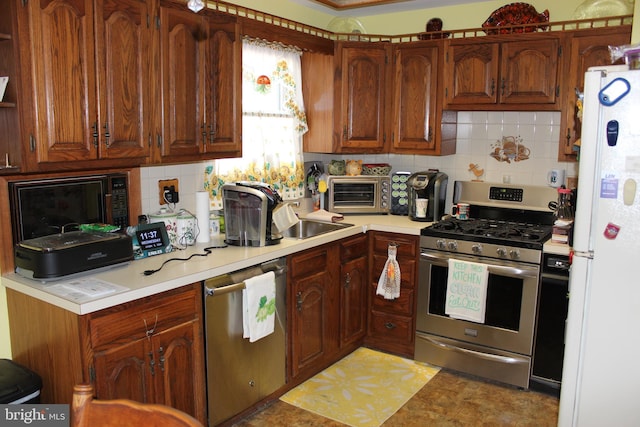 kitchen featuring backsplash, sink, and stainless steel appliances