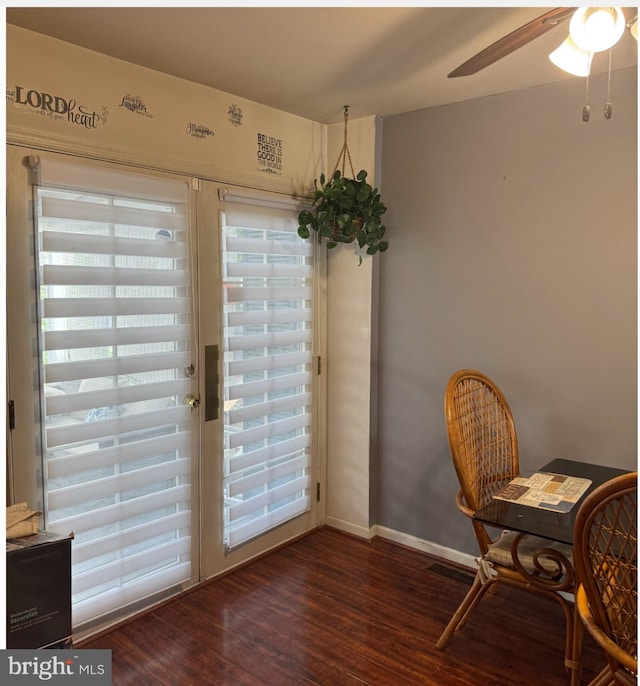 doorway to outside featuring ceiling fan and dark hardwood / wood-style flooring