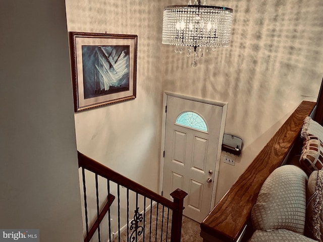 entrance foyer with a notable chandelier