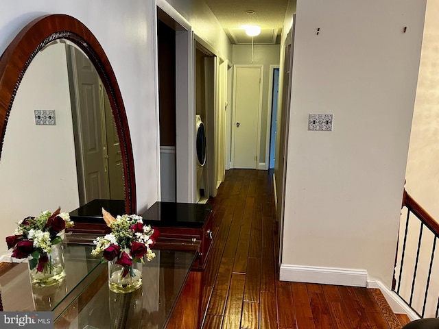 corridor with dark hardwood / wood-style floors