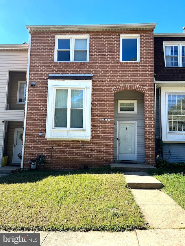 view of property with a front lawn