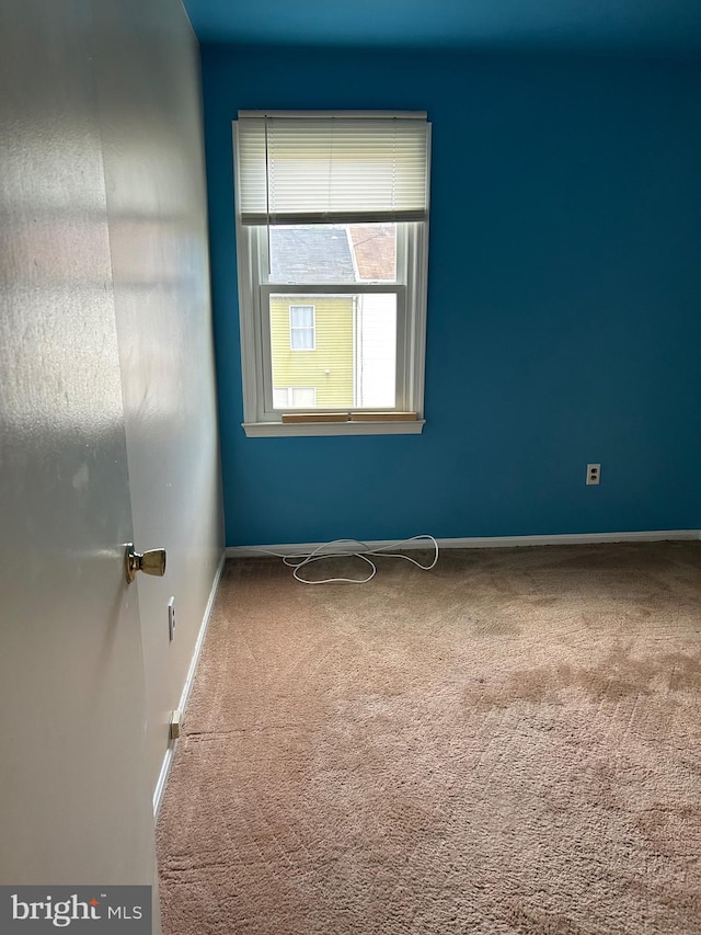 empty room featuring carpet flooring