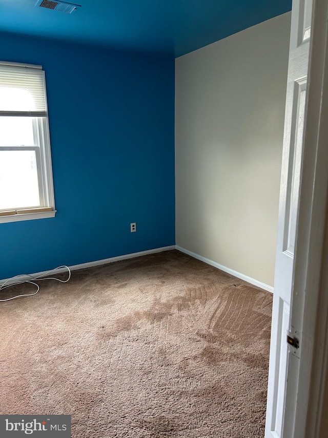 empty room featuring carpet flooring