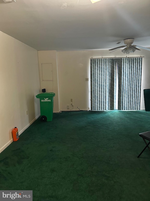 spare room with carpet flooring and ceiling fan