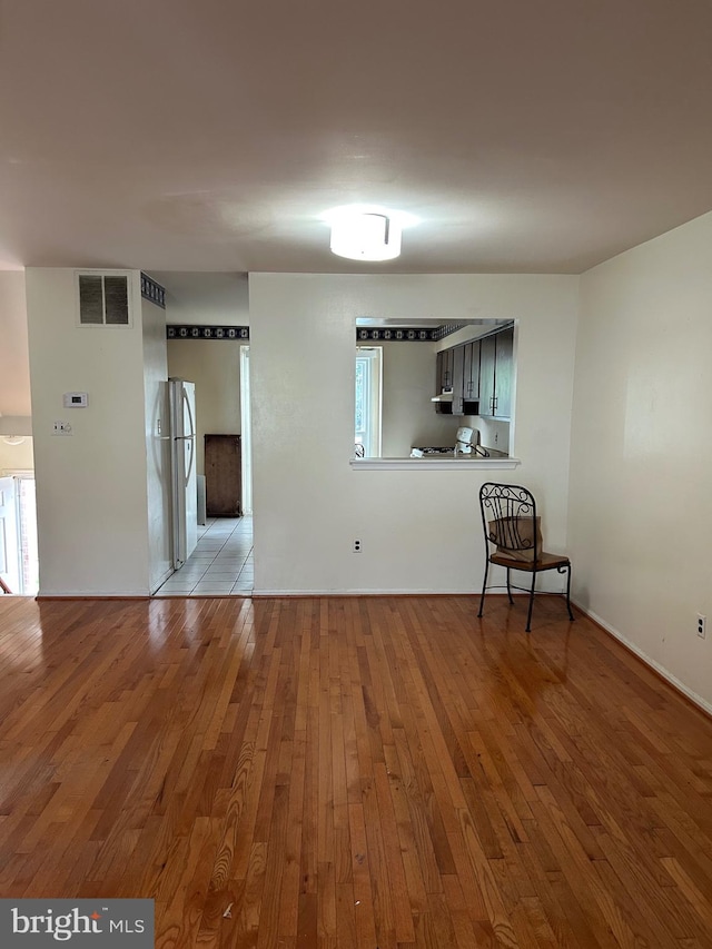 unfurnished room featuring light wood-type flooring